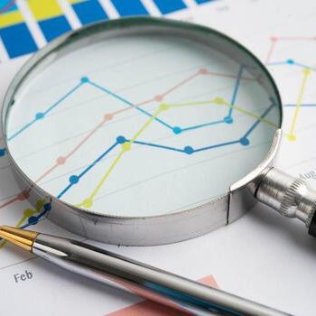 magnifying-glass-charts-graphs-paper-financial-development-account-photo